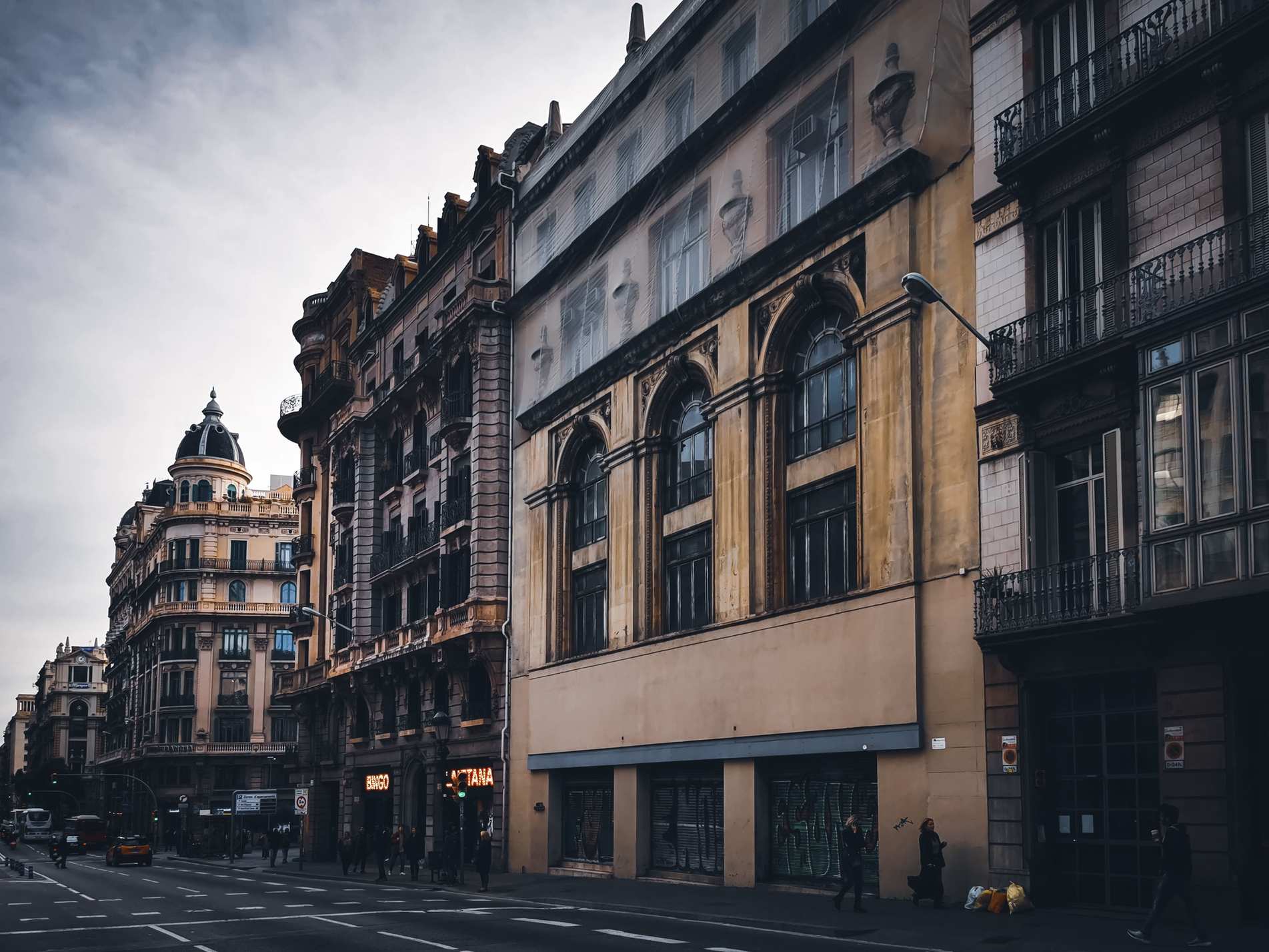 City street with commercial office buildings and classic urban architecture facades
